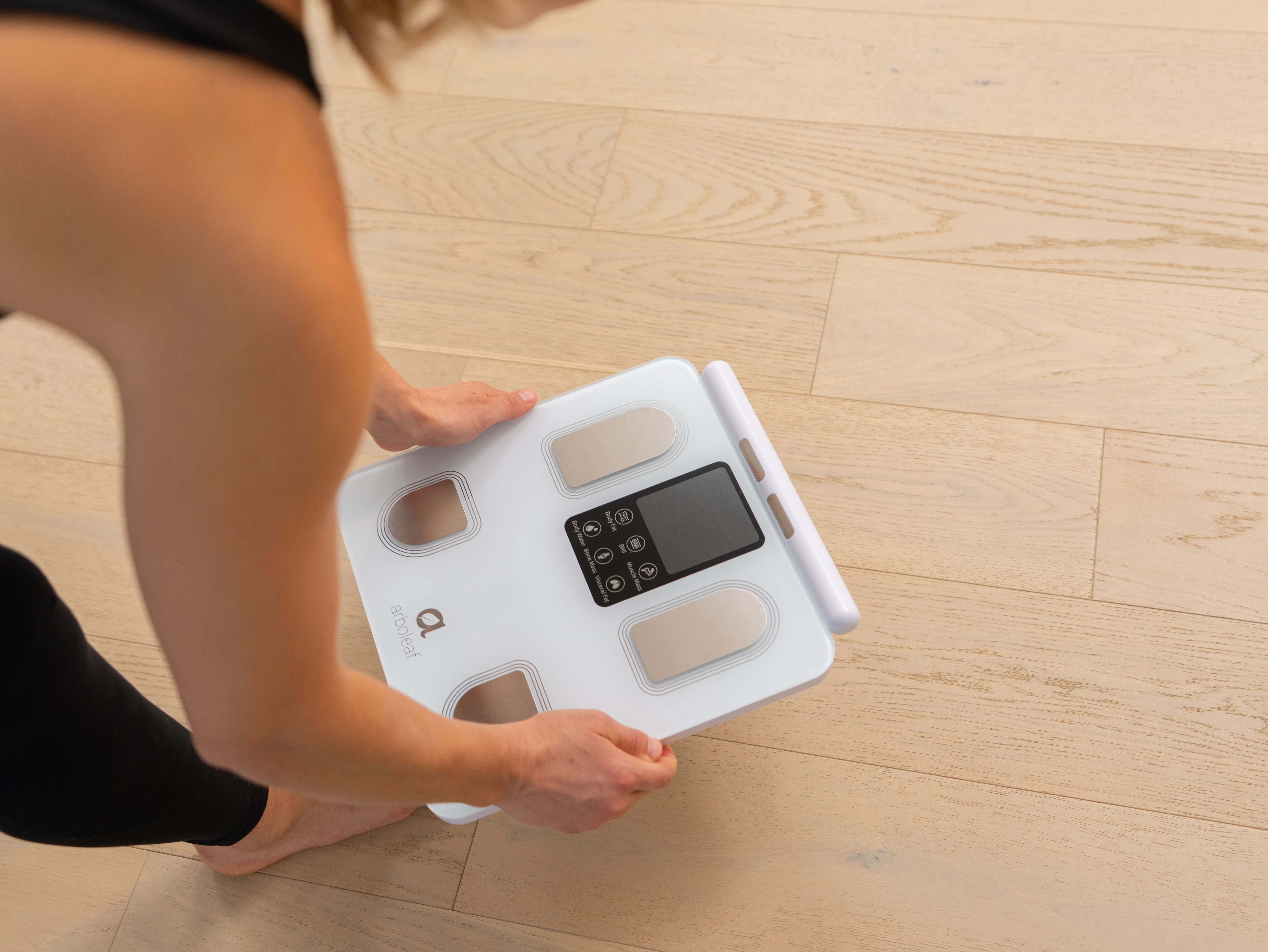 Place the Arboleaf body fat scale on the floor.