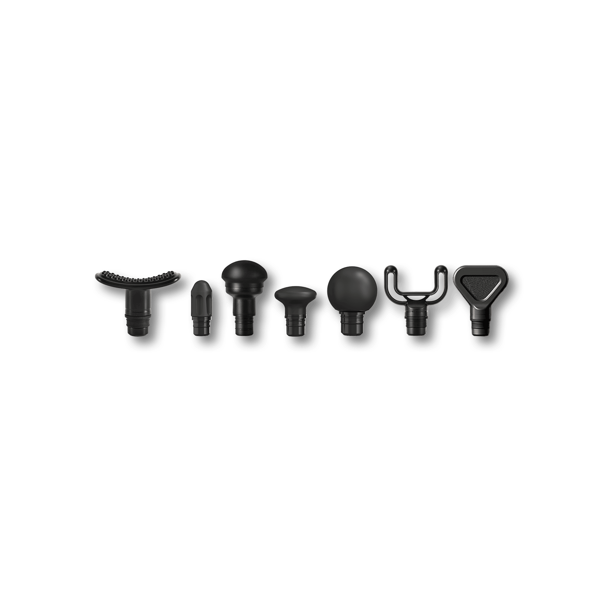 Set of black plastic massage heads on a green background