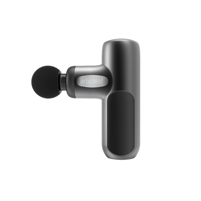 A handheld electric massager with a black color scheme, featuring a rounded head and a grip handle with a button on the side.
