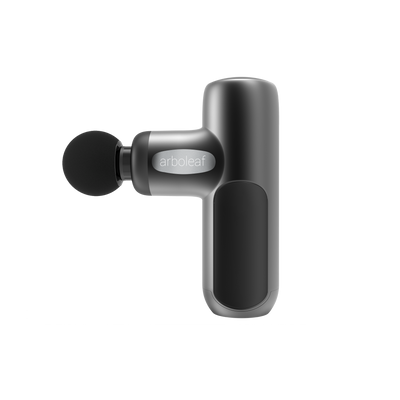 A handheld electric massager with a black color scheme, featuring a rounded head and a grip handle with a button on the side.