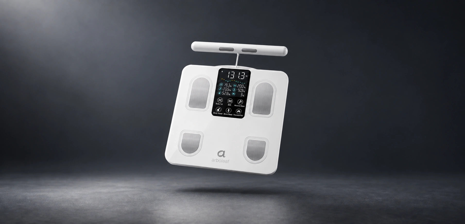 White Arboleaf CS10E scale and handgrip suspended over a pale silver studio floor